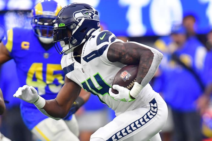 Seattle Seahawks wide receiver DK Metcalf (14) runs the ball against Los Angeles Rams linebacker Ernest Jones (53) during the first half at SoFi Stadium.